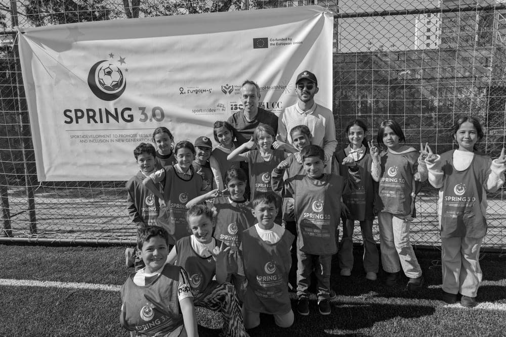 Jeff Gomez with children at a sport for development programme
