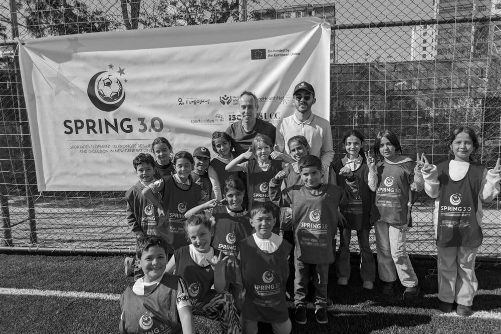 Jeff Gomez with children at a sport for development programme